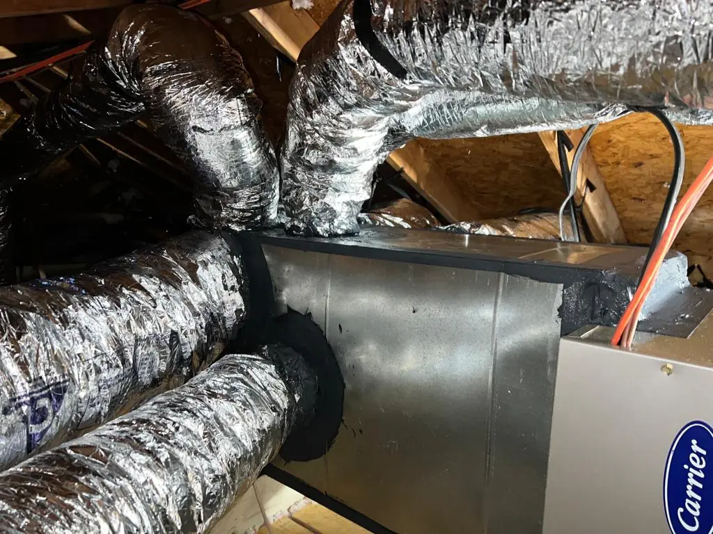 Insulated flex duct runs tied into a mastic sealed plenum on a Carrier air handler